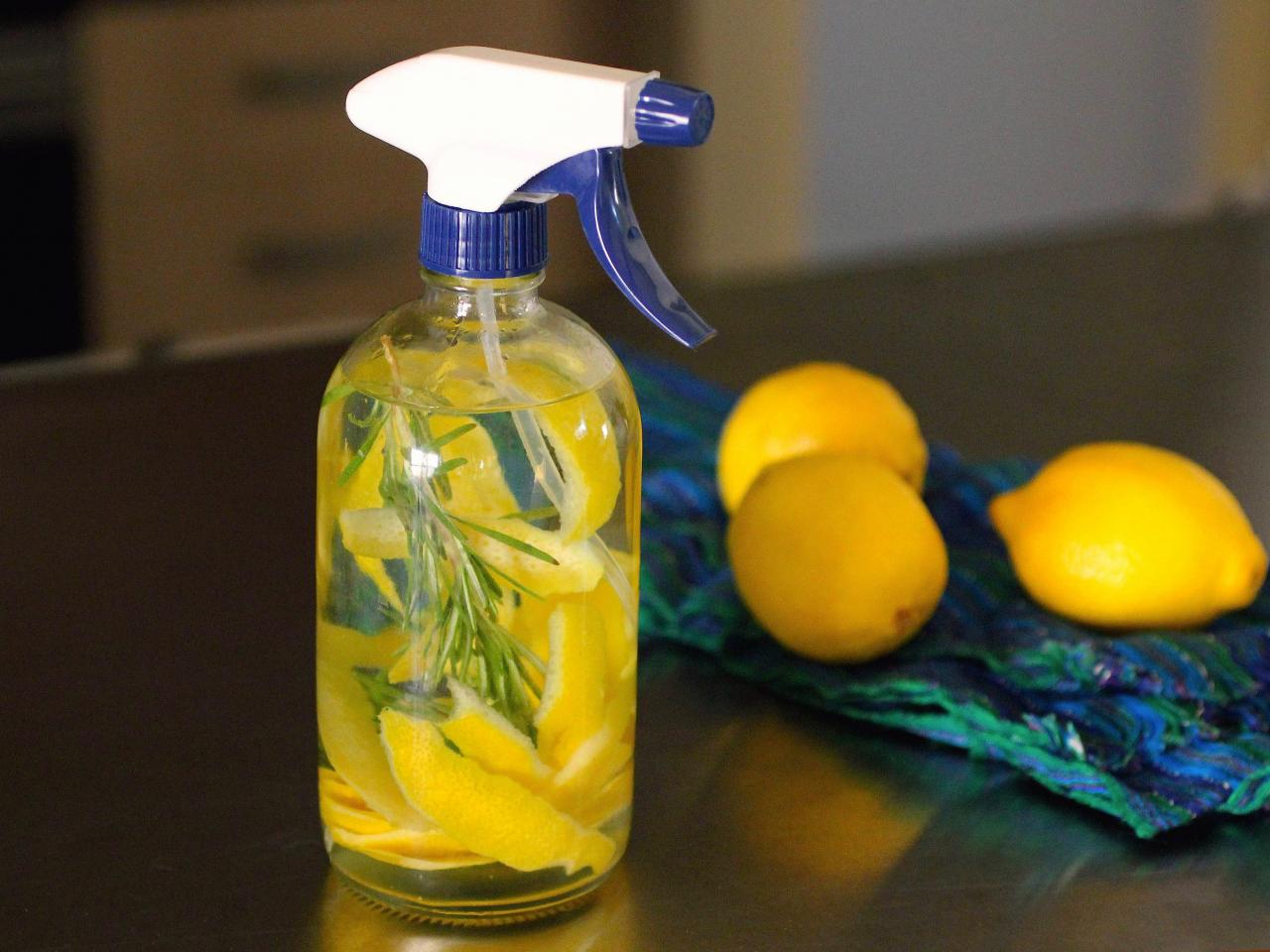 a spray bottle filled with natural cleaning solution, surrounded by fresh lemons, lavender, or other natural ingredients
